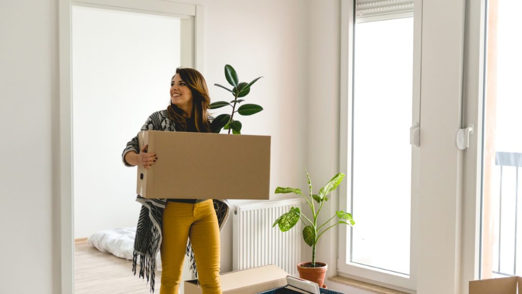 Girl carrying a box